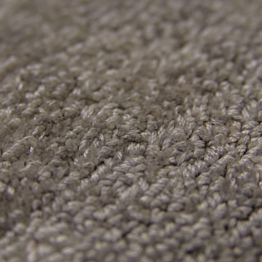 Ingezoomd op het materiaal en weeftechniek.
