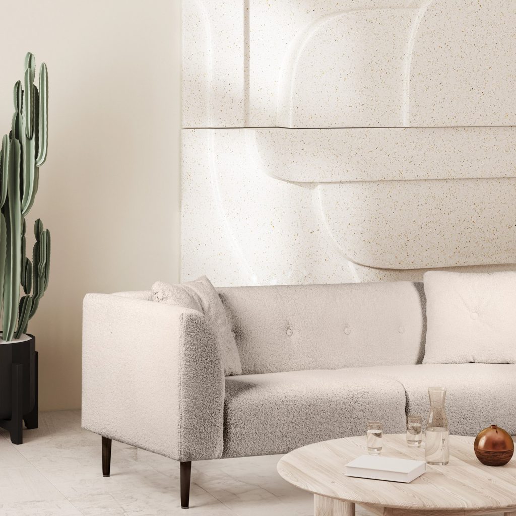 Witte kamer met witte bank, schilderij, bijzettafel en plant