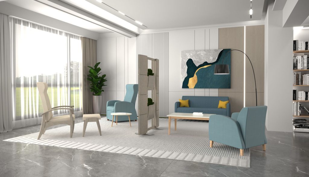 Witte ruimte met blauwe stoelen en schilderij.