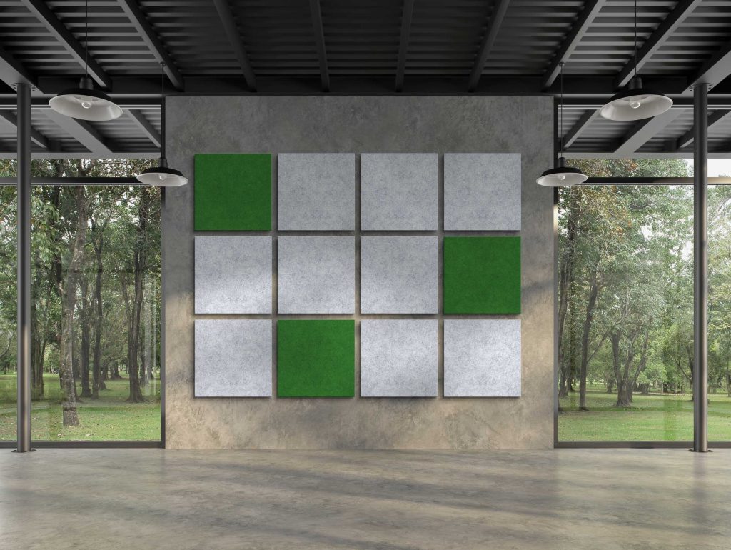 Een grijze wand met groene en grijze wandpanelen van Whisperwool van Tante Lotte Design