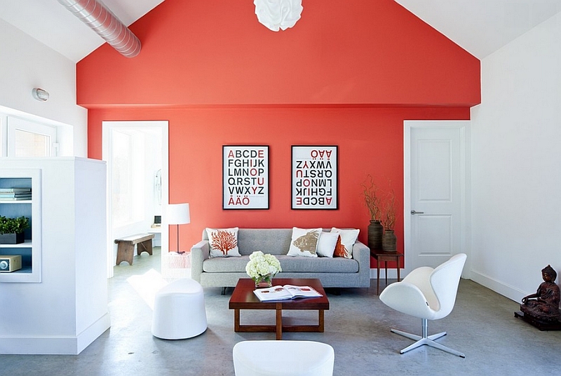 Farmhouse-style-living-room-with-a-bright-coral-accent-wall-and-iconic-decor